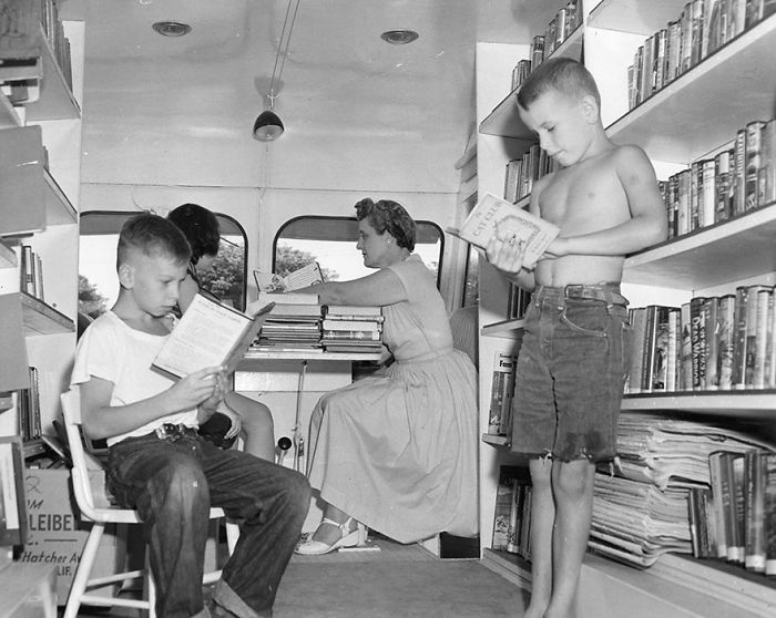 Craig Medvigny (left) And David Sutton Enjoying A Book; Eleanor Mann Substitute Traveling Branch Librarian, C. 1920s