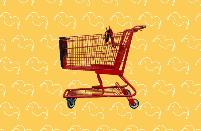 A red shopping cart against a yellow background
