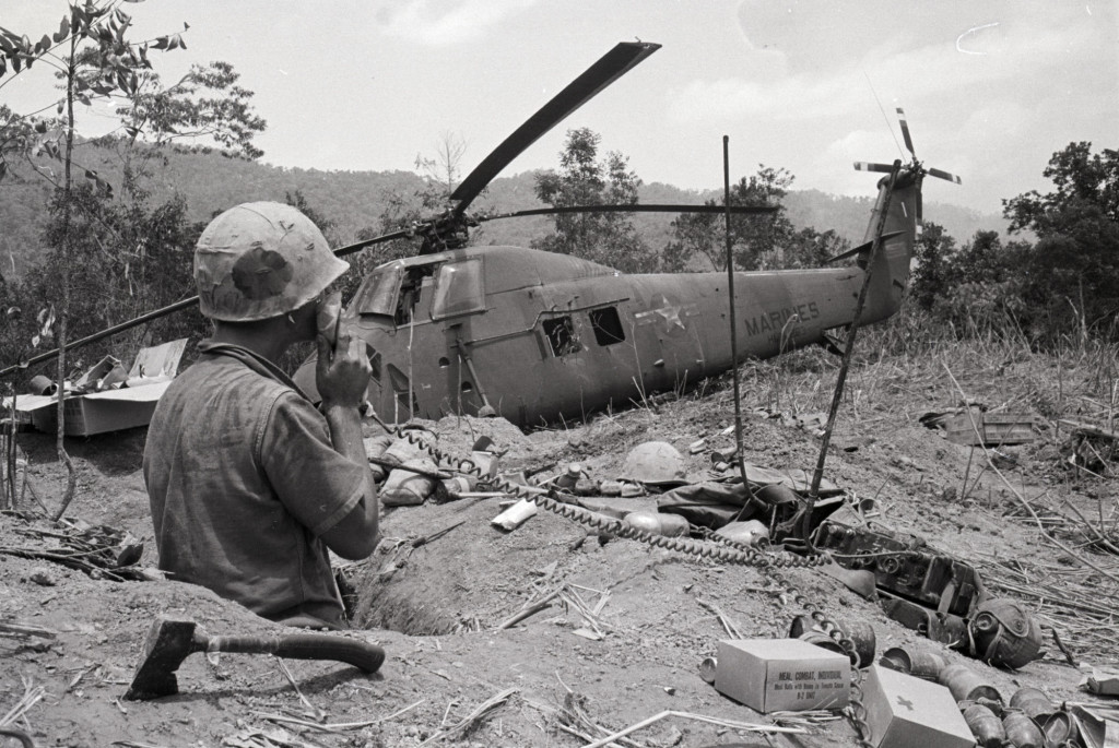 Soldier with Radio near Downed Helicopter