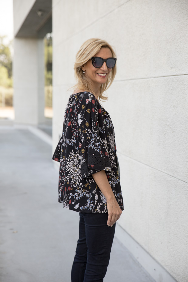 casual black floral print top with lace trim side view