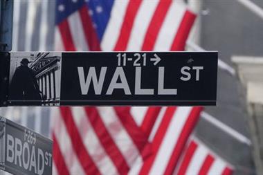 A U.S flag is seen on the New York Stock Exchange in the Manhattan borough of New York City, following the 2020 U.S. presidential election, New York, U.S., November 6, 2020. REUTERS/Carlo Allegri