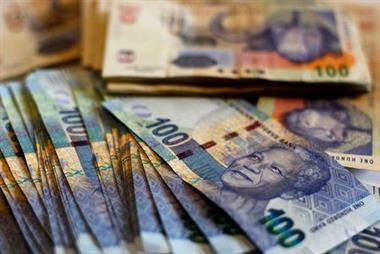 South African bank notes featuring an image of former South African President Nelson Mandela are displayed at an office in Johannesburg, file. REUTERS/Siphiwe Sibeko 