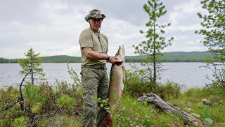 Президент России Владимир Путин во время рыбалки в Красноярском крае. Архивное фото.