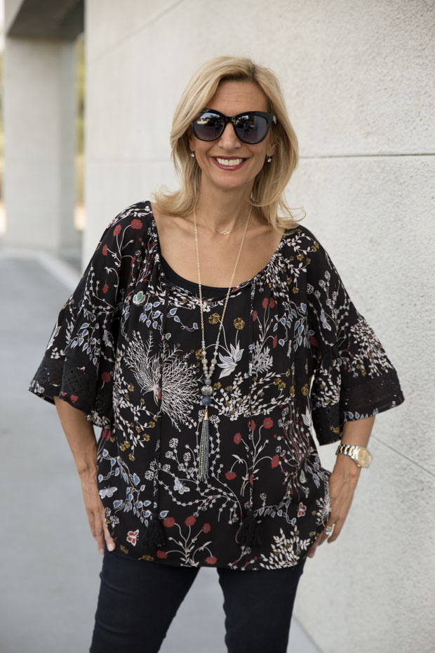 black floral print top with lace trim close up