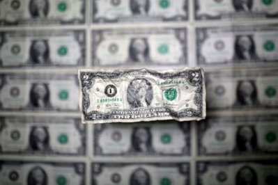 U.S. dollar banknote is seen in this picture illustration taken May 3, 2018. REUTERS/Dado Ruvic/Illustration