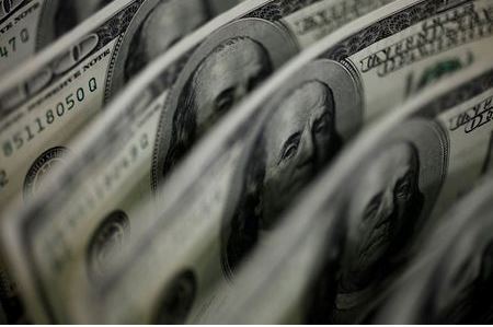 A picture illustration shows U.S. 100 dollar bank notes taken in Tokyo August 2, 2011. The Swiss franc rose to a record high against the euro and was close to a record versus the dollar on Tuesday as concerns about euro zone sovereign debt problems and a slowdown in the global economy buoyed demand for the safe-haven currency. REUTERS/Yuriko Nakao (JAPAN - Tags: BUSINESS POLITICS)