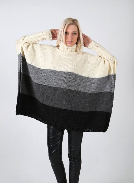 Hand knitted four colour poncho with long sleeves and high collar. Handmade knit.: 