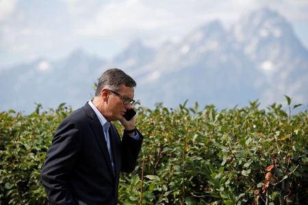 Federal Reserve Vice Chair Richard Clarida talks on the phone during the three-day "Challenges for Monetary Policy" conference in Jackson Hole, Wyoming, U.S., August 23, 2019. REUTERS/Jonathan Crosby