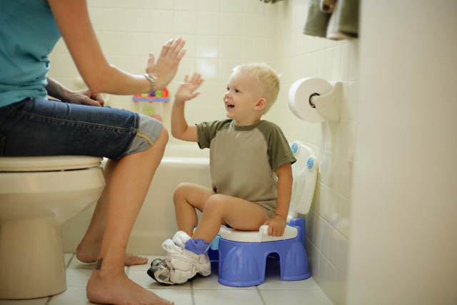 Mother and Son High-fiving --- Image by © David P. Hall/Corbis