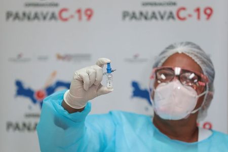A nurse shows a vial of the Pfizer-BioNTech COVID-19 vaccine at the Santo Tomas Hospital, in Panama City, Panama February 17, 2021. REUTERS/Erick Marciscano