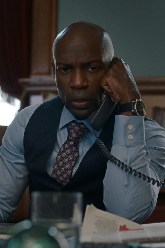 David Gyasi as Dennison on phone