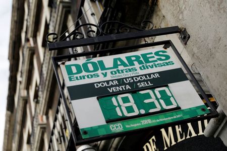 A board displaying exchange rates for Mexican Peso and U.S. Dollar is pictured at a foreign exchange house in Mexico City, Mexico June 6, 2019. REUTERS/Edgard Garrido