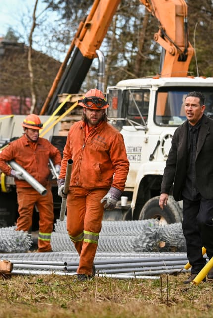 Manny and Bode walk away from the accident scene - Fire Country Season 2 Episode 7