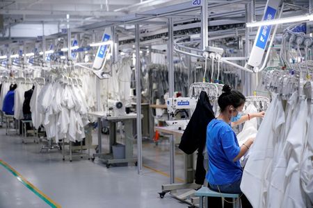 A worker works at Xunxi factory, which is an affiliate of Chinese e-commerce giant Alibaba, during a media tour, in Hangzhou, Zhejiang province, China November 10, 2020. REUTERS/Aly Song