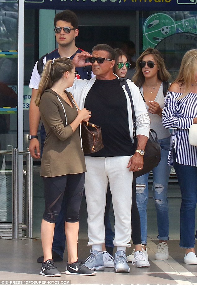 Making his grand arrival: Stallone was dressed for comfort, donning a pair of silver trainers and wearing a large black bag slung over one shoulder