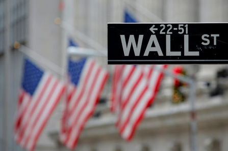FILE PHOTO: A street sign for Wall Street is seen outside the New York Stock Exchange (NYSE) in Manhattan, New York City, U.S. December 28, 2016. REUTERS/Andrew Kelly