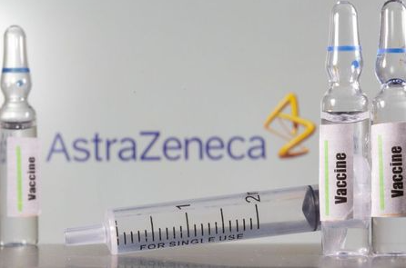 A test tube labelled with the Vaccine is seen in front of AstraZeneca logo in this illustration taken, September 9, 2020. REUTERS/Dado Ruvic/Illustration