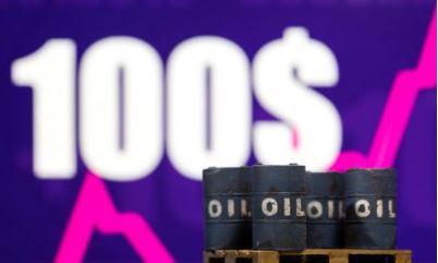 Models of oil barrel are seen in front of displayed rising stock graph and words "100 Dollars" in this illustration taken, February 23, 2022. REUTERS/Dado Ruvic/Illustration