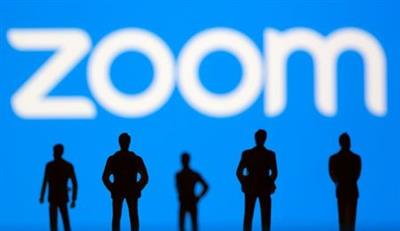 Small toy figures are seen in front of Zoom logo in this illustration picture taken March 15, 2021. REUTERS/Dado Ruvic/Illustration