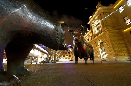 FILE PHOTO: Bull and bear symbols in front of the German stock exchange (Deutsche Boerse) in Frankfurt, Germany, February 12, 2019. REUTERS/Kai Pfaffenbach