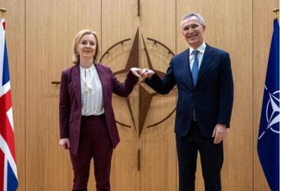 NATO Secretary General Jens Stoltenberg welcomes British Foreign Secretary Liz Truss before their bilateral meeting in Brussels, Belgium, January 24, 2022. Olivier Matthys/Pool via REUTERS