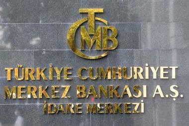 A logo of Turkey's Central Bank is pictured at the entrance of its headquarters in Ankara, Turkey October 15, 2021. REUTERS/Cagla Gurdogan 