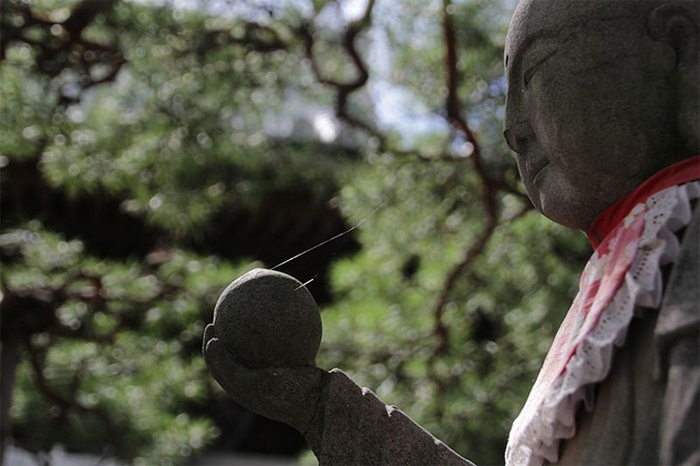 Реплика статуи Будды из храма Дзэнкодзи.