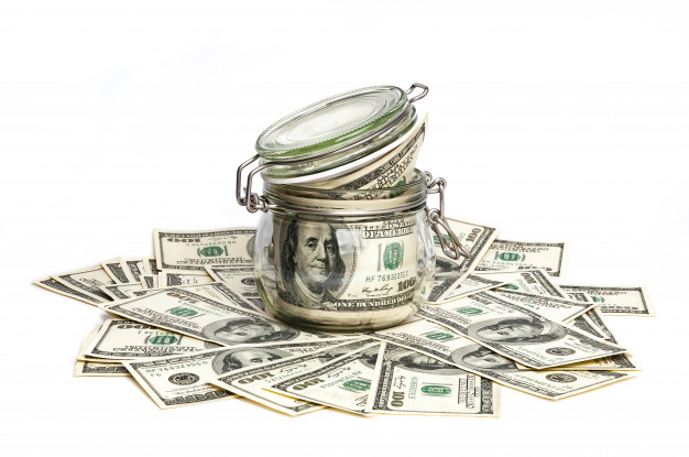 https://image.freepik.com/free-photo/a-glass-jar-filled-with-dollars-among-a-hundred-dollar-bills-on-a-white-background_76263-179.jpg