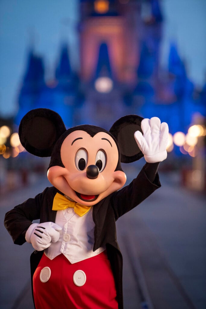 In this handout photo provided by Walt Disney World Resort, Mickey Mouse pauses on Main Street, U.S.A. just before sunrise at Walt Disney World Resort on July 11, 2020 in Lake Buena Vista, Florida.