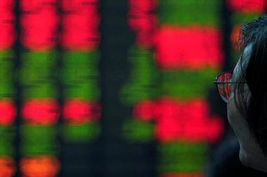 An investor looks at an electronic board showing stock information at a brokerage house in Shanghai, China July 6, 2018. REUTERS/Aly Song