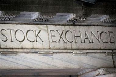 "Stock Exchange" is seen over an entrance to the New York Stock Exchange (NYSE) on Wall St. in New York City, U.S., March 29, 2021. REUTERS/Brendan McDermid 