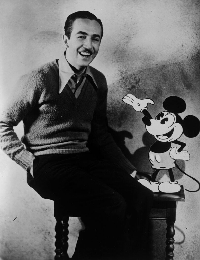 American animator and producer Walt Disney with one of his creations Mickey Mouse.  