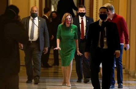 Speaker of the House Nancy Pelosi (D-CA) walks back to her office after opening the House floor following an agreement of a coronavirus disease (COVID-19) aid package the night before on Capitol Hill, Washington, D.C., U.S., December 21, 2020. REUTERS/Ken Cedeno