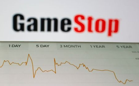 GameStop stock graph is seen in front of the company's logo in this illustration taken February 2, 2021. REUTERS/Dado Ruvic/Illustration