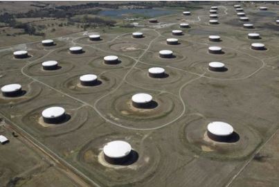 FILE PHOTO: Crude oil storage tanks are seen from above at the Cushing oil hub, in Cushing, Oklahoma, March 24, 2016. REUTERS/Nick Oxford/File Photo