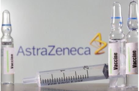 A test tube labelled with the Vaccine is seen in front of AstraZeneca logo in this illustration taken, September 9, 2020. REUTERS/Dado Ruvic/Illustration