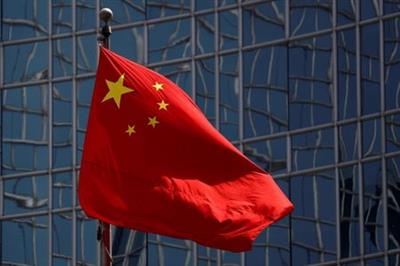 FILE PHOTO: The Chinese national flag is seen in Beijing, China April 29, 2020. REUTERS/Thomas Peter/File Photo