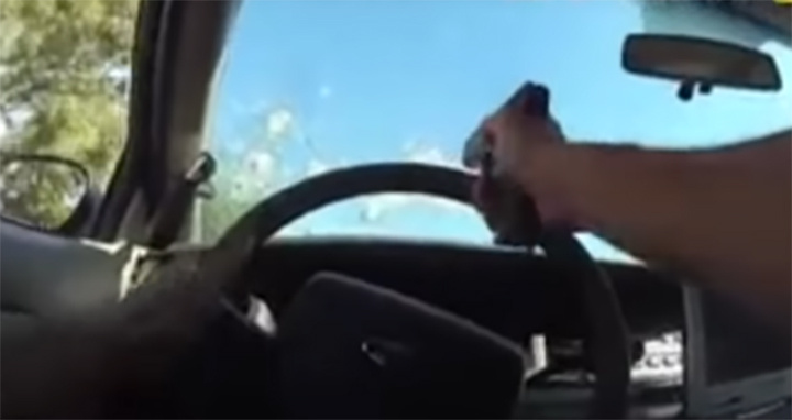    Май 2019-го в городе Анахайм, штат Калифорния. Полицейский стреляет через лобовое стекло в пытающегося уехать вооружённого наркомана. Скриншот: соцсети