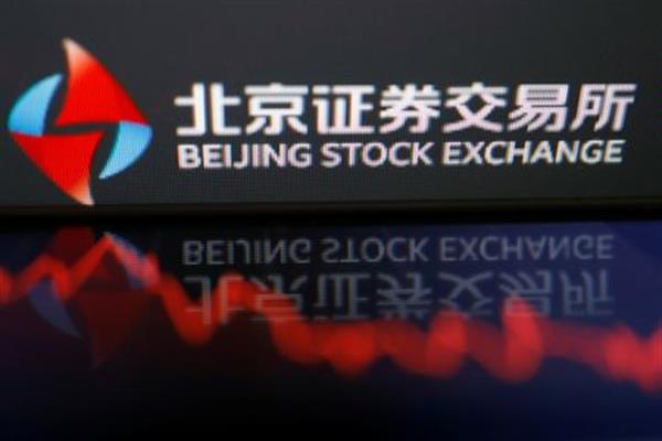 The logo of China's Beijing Stock Exchange is seen by a stock chart in this illustration picture taken November 12, 2021. REUTERS/Florence Lo/Illustration