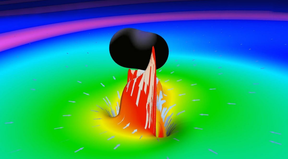 Мгновенная симуляция слияния двух черных дыр. Столкновение двух вращающихся червоточин вызвало бы подобное искажение пространства-времени, оставляя за собой «эхо» в сигнале / <em>LIGO LabCaltech</em>