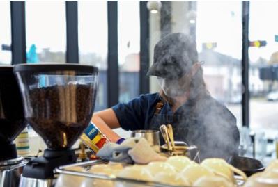 FILE PHOTO: A barista makes coffee for a customer in Houston, Texas, U.S., March 10, 2021. REUTERS/Callaghan O's;Hare/File Photo/File Photo
