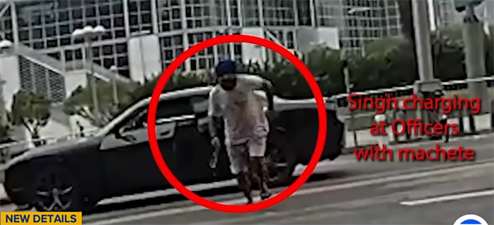    Обдолбавшийся сикхский "воин" бежит на полицейского с мачете. Скриншот: abc7.com
