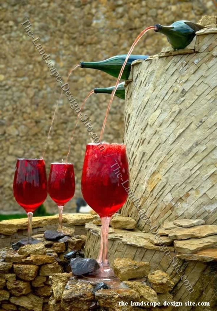 Garden Fountains Ideas, Another unique garden fountain idea for the wine enthusiast's garden. However, the wine coloured mixture does add an attractive focal point to the garden or landscape.: 