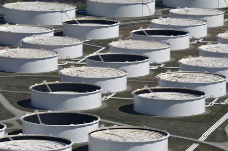 FILE PHOTO: Crude oil storage tanks are seen from above at the Cushing oil hub, appearing to run out of space to contain a historic supply glut that has hammered prices, in Cushing, Oklahoma, March 24, 2016. REUTERS/Nick Oxford