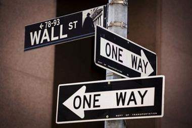 FILE PHOTO: A 'Wall St' sign is seen above two 'One Way' signs in New York August 24, 2015. REUTERS/Lucas Jackson/File Photo