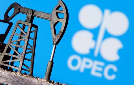 A 3D printed oil pump jack is seen in front of displayed Opec logo in this illustration picture, April 14, 2020. REUTERS/Dado Ruvic/Illustration