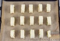 Фото приготовления рецепта: Слоёные рулетики с ветчиной, сыром и чесноком - шаг №11