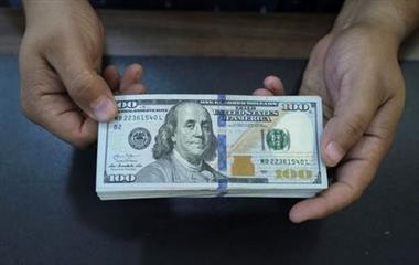A seller shows the U.S. dollars currency inside an exchange shop in Benghazi, Libya September 1, 2021. Picture taken September 1, 2021. REUTERS/Esam Omran Al-Fetori 