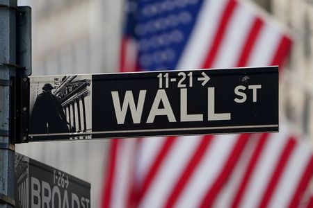 FILE PHOTO: The Wall Street sign is pictured at the New York Stock exchange (NYSE) in the Manhattan borough of New York City, New York, U.S., March 9, 2020. REUTERS/Carlo Allegri