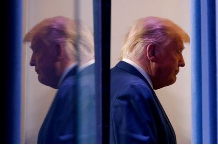 U.S. President Donald Trump is reflected as he departs after speaking about the 2020 U.S. presidential election results in the Brady Press Briefing Room at the White House in Washington, U.S., November 5, 2020. REUTERS/Carlos Barria TPX IMAGES OF THE DAY